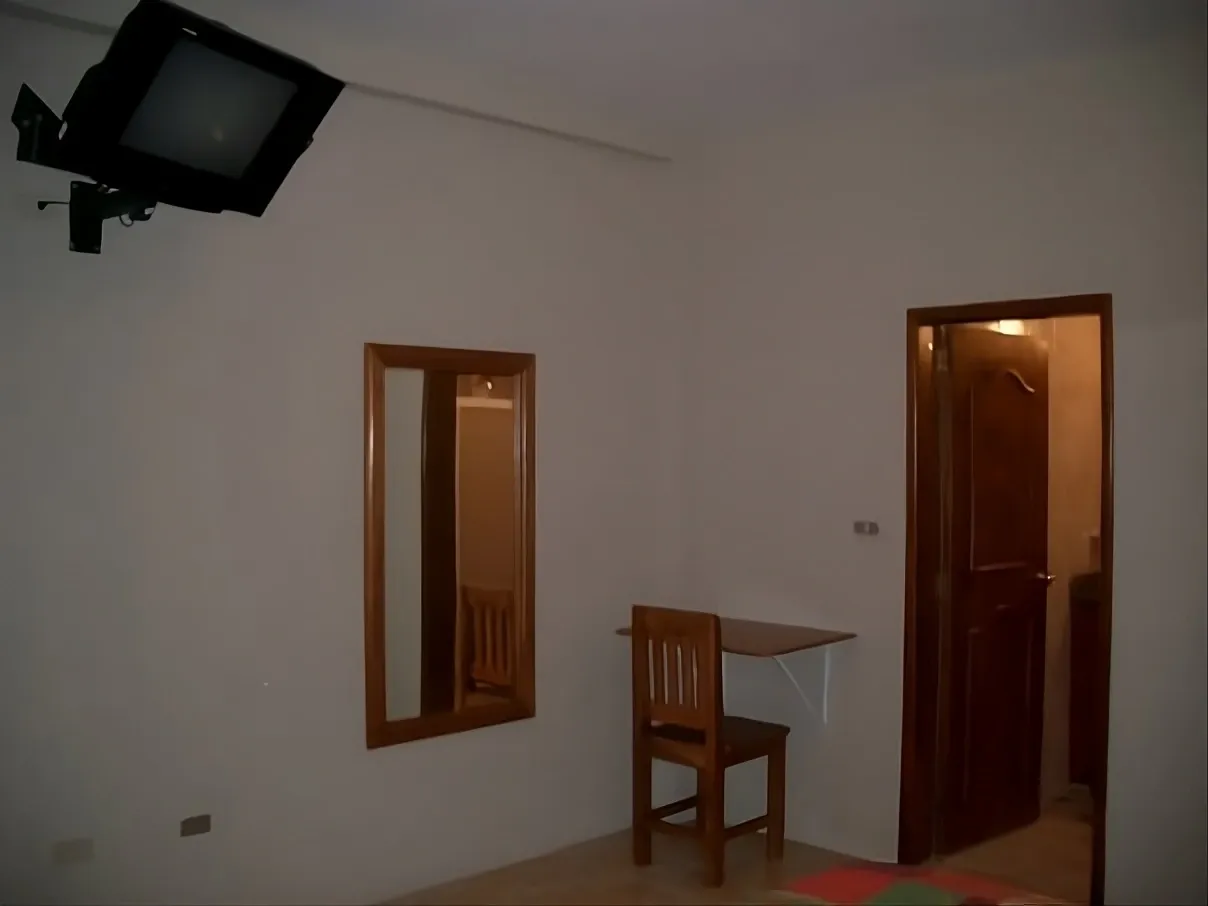 Habitación con camas matrimoniales en Aparto-Hotel Florencia